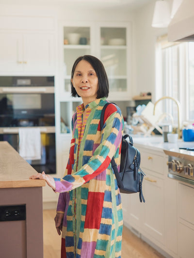 Smiling woman wearing a backpack