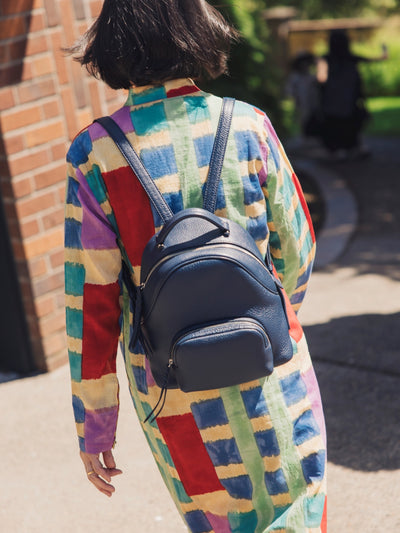 Back view of a woman wearing a backpack