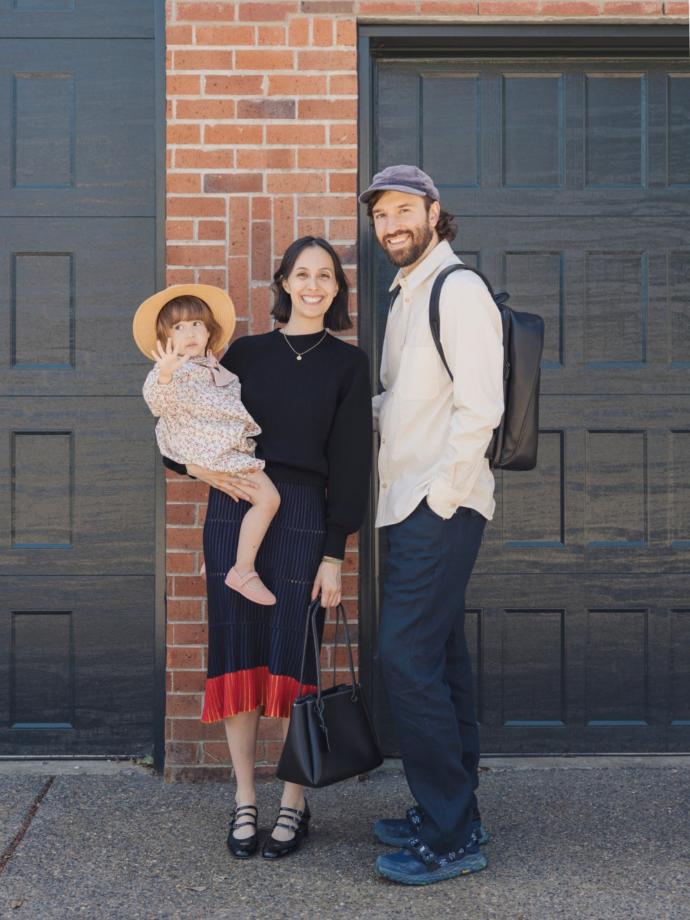 Smiling father, mother, and daughter