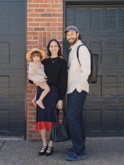 Smiling father, mother, and daughter