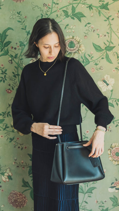 Woman holding a shoulder bag