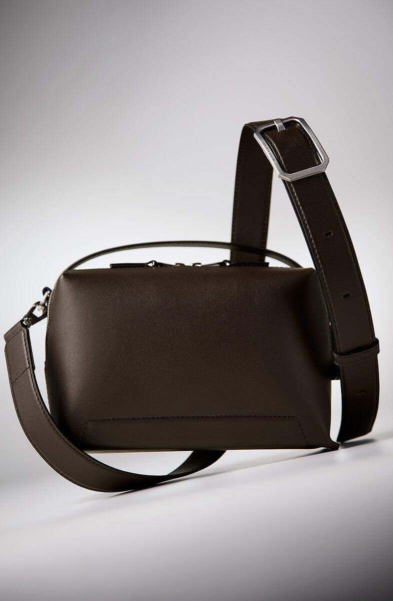 Brown leather top handle crossbody with a strap on a light gray background | Made in Japan | Straven Collection